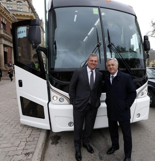 WAYNE GLOWACKI / WINNIPEG FREE PRESS   At left, Paul Soubry, New Flyer president and CEO with Brian Tobin,Chairman of the Board pose for a picture before boarding a MCI bus outside the Manitoba Club Friday with Bay Street analysts for a  tour the plants.  Martin Cash  story  May 13  2016