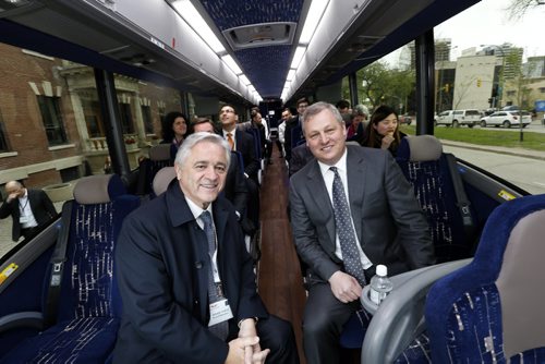 WAYNE GLOWACKI / WINNIPEG FREE PRESS   At right, Paul Soubry, New Flyer president and CEO with Brian Tobin, Chairman of the Board in a MCI bus outside the Manitoba Club Friday with Bay Street analysts for a tour of the plants.  Martin Cash  story  May 13  2016