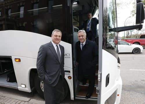WAYNE GLOWACKI / WINNIPEG FREE PRESS   At left, Paul Soubry, New Flyer president and CEO with Brian Tobin,Chairman of the Board getting ready to board a MCI bus outside the Manitoba Club Friday with Bay Street analysts for a tour of the plants.  Martin Cash  story  May 13  2016