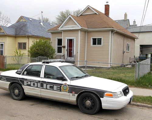 BORIS MINKEVICH / WINNIPEG FREE PRESS Crime scene at 672 Wellington Ave. Police come back to the scene to secure the building. May 13, 2016.