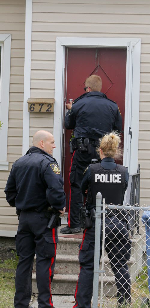 BORIS MINKEVICH / WINNIPEG FREE PRESS Crime scene at 672 Wellington Ave. Police come back to the scene to secure the building. May 13, 2016.