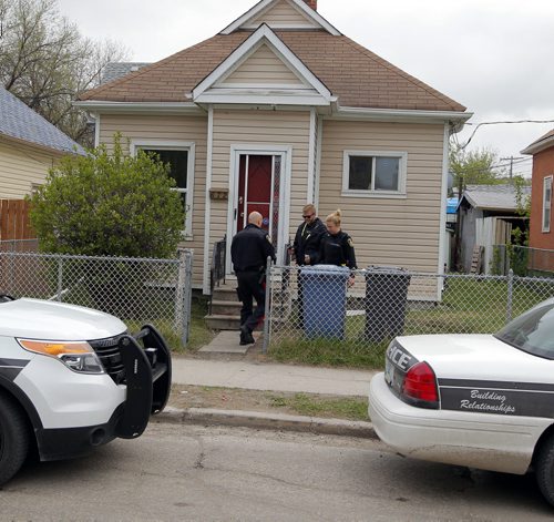 BORIS MINKEVICH / WINNIPEG FREE PRESS Crime scene at 672 Wellington Ave. Police come back to the scene to secure the building. May 13, 2016.