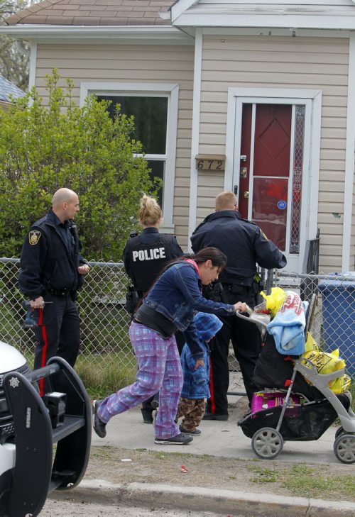 BORIS MINKEVICH / WINNIPEG FREE PRESS Crime scene at 672 Wellington Ave. Police come back to the scene to secure the building. May 13, 2016.