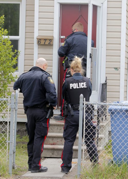 BORIS MINKEVICH / WINNIPEG FREE PRESS Crime scene at 672 Wellington Ave. Police come back to the scene to secure the building. May 13, 2016.