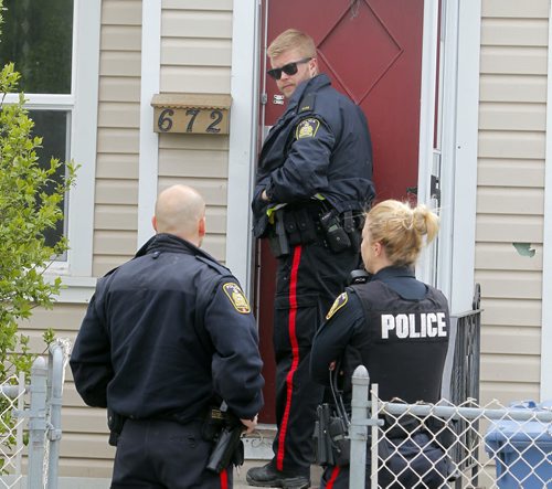 BORIS MINKEVICH / WINNIPEG FREE PRESS Crime scene at 672 Wellington Ave. Police come back to the scene to secure the building. May 13, 2016.