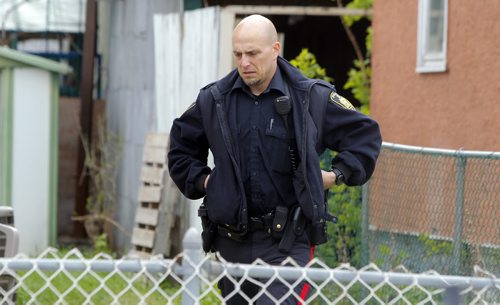 BORIS MINKEVICH / WINNIPEG FREE PRESS Crime scene at 672 Wellington Ave. Police come back to the scene to secure the building. May 13, 2016.