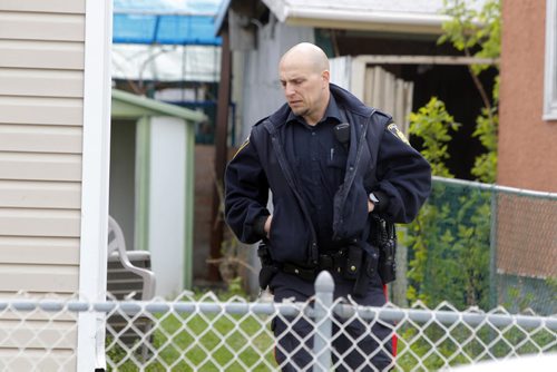 BORIS MINKEVICH / WINNIPEG FREE PRESS Crime scene at 672 Wellington Ave. Police come back to the scene to secure the building. May 13, 2016.