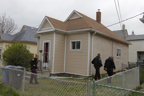 BORIS MINKEVICH / WINNIPEG FREE PRESS Crime scene at 672 Wellington Ave. Police come back to the scene to secure the building. May 13, 2016.