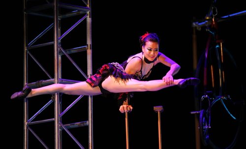 RUTH BONNEVILLE / WINNIPEG FREE PRESS  A contortionist performs the splits while holding herself up with one arm on the top of an 18-foot, pedal-powered Gantry Crane while performing in the  Cirque Mechanics at WSO Friday night.  The show combines combines acrobats, aerialists, trapeze artists,  contortionists and an 18-foot, pedal-powered Gantry Crane with music by Tchaikovsky, Strauss, Copland, and Ravel at WSO Friday evening.    Cirque Mechanics was founded in 2004 by German wheel artist Chris Lashua and with its innovative mechanical staging and inspiring storytelling.    May 13, , 2016