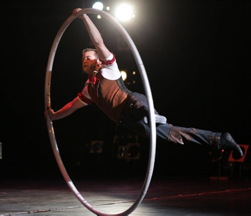 RUTH BONNEVILLE / WINNIPEG FREE PRESS  A performer in the  Cirque Mechanics turns his body into a human set of spokes as he spins on a large hoop at WSO Friday night.  The show combines combines acrobats, aerialists, trapeze artists,  contortionists and an 18-foot, pedal-powered Gantry Crane with music by Tchaikovsky, Strauss, Copland, and Ravel at WSO Friday evening.    Cirque Mechanics was founded in 2004 by German wheel artist Chris Lashua and with its innovative mechanical staging and inspiring storytelling.    May 13, , 2016
