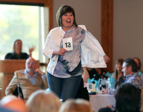 JASON HALSTEAD / WINNIPEG FREE PRESS  Model Cheryl Franz shows off clothes at the fourth annual Hope Springs Into Fashion fundraiser for Ovarian Cancer Canada research at St. Boniface Golf Club on April 28, 2016. (See Social Page)