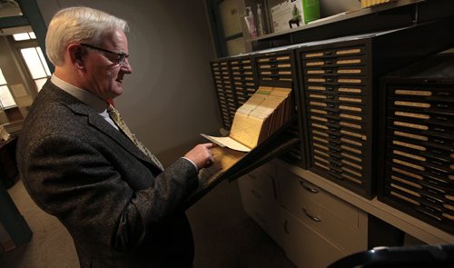 PHIL HOSSACK / WINNIPEG FREE PRESS -  Dr Robert Tate, Dorector of the "Follow Up Study" that has followed a group of air force veterans since World War 2 digs into old kardex files containing records on individual airmen.  See Kevin Rollason's story.   May 16, 2016