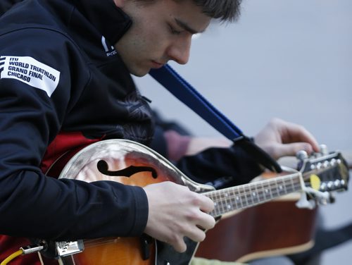 JOHN WOODS / WINNIPEG FREE PRESS A musician tunes up prior to his performance at Caravan, an open mic event at Old Market Square, Monday, May 16, 2016.