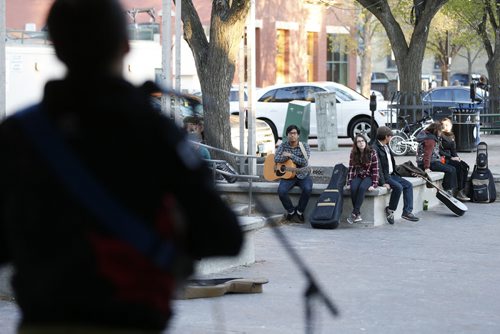 JOHN WOODS / WINNIPEG FREE PRESS Performers and spectators watch Brendan and Dave at Caravan, an open mic event at Old Market Square, Monday, May 16, 2016.