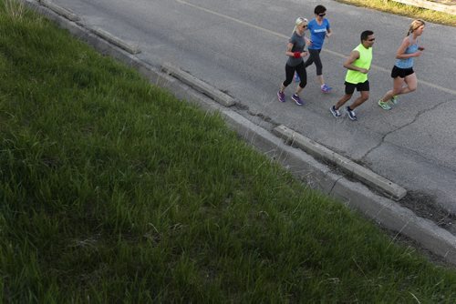 JOHN WOODS / WINNIPEG FREE PRESS Runners take part in Pop-Up The Hill, a pre-run for September's Ted's Run For Literacy, at Westview Park (a.k.a. Garbage Hill) Tuesday, May 17, 2016.