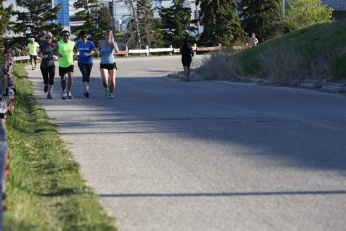 JOHN WOODS / WINNIPEG FREE PRESS Runners take part in Pop-Up The Hill, a pre-run for September's Ted's Run For Literacy, at Westview Park (a.k.a. Garbage Hill) Tuesday, May 17, 2016.