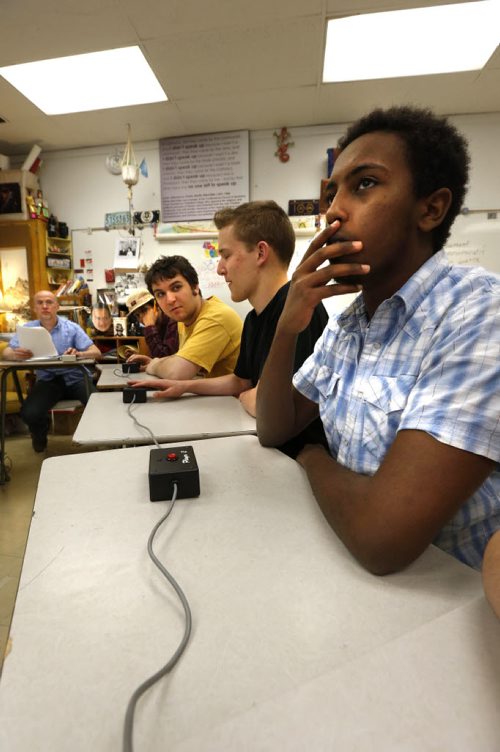 WAYNE GLOWACKI / WINNIPEG FREE PRESS    49.8 Intersection. from right, Natea Eshetu-Beshada ponders a question with team mates Theoren Terra, Eric Keilback and Mohamed Aden during the  Kelvin High School Reach for the Top team practice over the lunch hour. At left is John Martens, one of the two coaches and acting quiz master for noon practice.  David Sanderson story May 18  2016