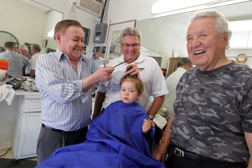 BORIS MINKEVICH / WINNIPEG FREE PRESS (left) Barber Rocky Curatola of Rocky's Men's Hair Styling cuts a fifth generation customer Lincoln Alto, just shy of 2 years old, while grandpa (centre) Dr. Lauri Alto, 61, and great grandpa (right) Olie Alto, 87, watch on. This is the boys 3rd haircut. The boys dad couldn't make it down for the photo because of work, but grandpa and great gramps were happy to help pass down the family tradition. Photo taken at the barber shop's current location at 290 Pembina Highway. May 19, 2016.