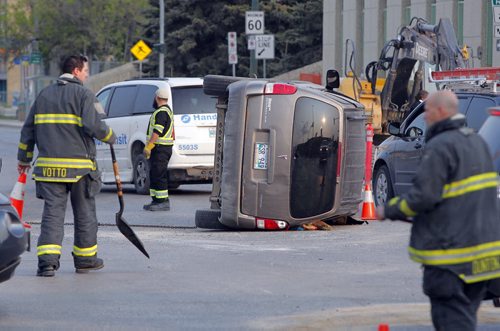 BORIS MINKEVICH / WINNIPEG FREE PRESS A van flipped over on Notre Dame and Sherbrook. MVC. No other details.. May 20, 2016.