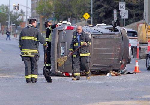 BORIS MINKEVICH / WINNIPEG FREE PRESS A van flipped over on Notre Dame and Sherbrook. MVC. No other details.. May 20, 2016.