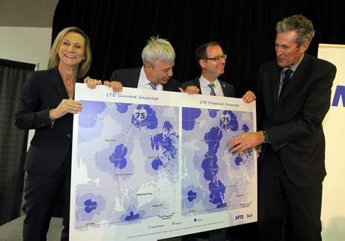 BORIS MINKEVICH / WINNIPEG FREE PRESS Official announcement of cell coverage improvements south of the city on highway 75. L-R  Patricia Solman (MTS, Wade Oosterman (Bell), Chris Goertzen (Association of Manitoba Municipalities), and Premier Brian Pallister. They pose with the before and after map of cell coverage involved. May 20, 2016.