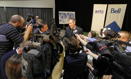 BORIS MINKEVICH / WINNIPEG FREE PRESS Official announcement of cell coverage improvements south of the city on highway 75. Premier Brian Pallister scrums after the presser. May 20, 2016.