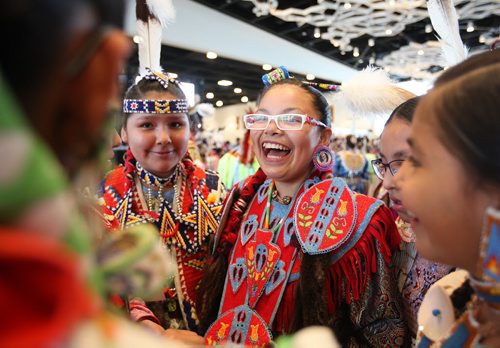 RUTH BONNEVILLE / WINNIPEG FREE PRESS  Laniece Asapace (glasses) and Verna Alex (blue headband) laugh together after dancing along with their friends from Keeseekoose FIrst Nation in Saskatchewan,at the Manito Ahbee International Pow Wow Saturday at the Convention Centre.   Standup photo   May 21, , 2016