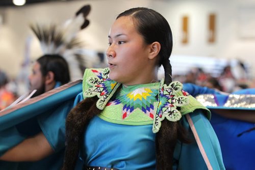 RUTH BONNEVILLE / WINNIPEG FREE PRESS  A young woman dances with hundreds of others at the  Manito Ahbee International Pow Wow Saturday at the Convention Centre.   Standup photo   May 21, , 2016