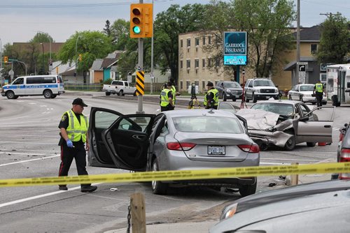 MIKE DEAL / WINNIPEG FREE PRESS  A motor vehicle accident between two cars at McPhillips and Redwood has closed down north and south bound McPhillips Monday morning. No word on condition of occupants of the vehicles.   160523 Monday, May 23, 2016
