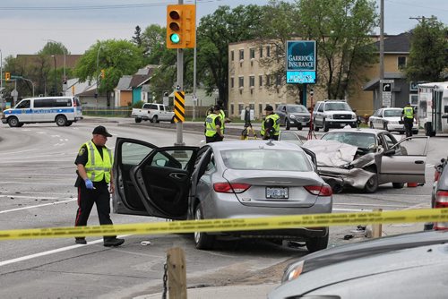 MIKE DEAL / WINNIPEG FREE PRESS A motor vehicle accident between two cars at McPhillips and Redwood has closed down north and south bound McPhillips Monday morning. No word on condition of occupants of the vehicles. 160523 - Monday, May 23, 2016