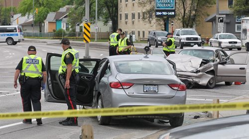 MIKE DEAL / WINNIPEG FREE PRESS A motor vehicle accident between two cars at McPhillips and Redwood has closed down north and south bound McPhillips Monday morning. No word on condition of occupants of the vehicles. 160523 - Monday, May 23, 2016
