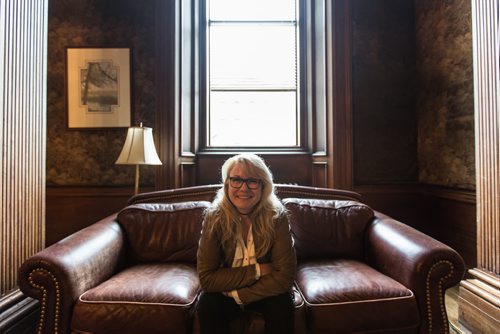 MIKE DEAL / WINNIPEG FREE PRESS The Millennium Centre at 389 Main Street is a heritage building located in the Exchange District. It is the previous home of the Canadian Imperial Bank of Commerce and is now used as an event venue. Cindy Tugwell, Executive Director for Heritage Winnipeg, sits on a leather couch in the 'tapestry room' of the Millennium Centre. 160510 - Tuesday, May 10, 2016