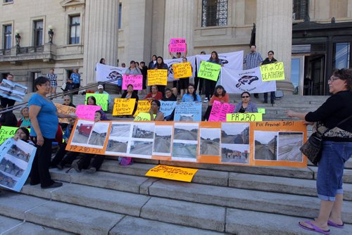 BORIS MINKEVICH / WINNIPEG FREE PRESS Dozens of protesters at the Manitoba Legislature on Tuesday at 1:30 demand the new provincial government improve the road between Thompson and Gillam. May 24, 2016.