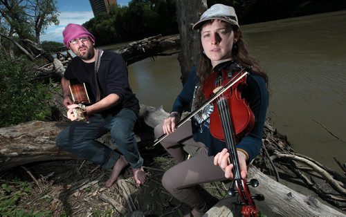 PHIL HOSSACK / WINNIPEG FREE PRESS -  David Fort and Brooklyn Mooneysun jam along the banks of the Assinaboine River Tuesday afternoon. The pair are doing several "River Based" concerts around North America this summer, See Dave Sanderson's story. May 24, 2016