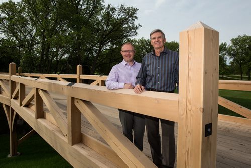 MIKE DEAL / WINNIPEG FREE PRESS (from Left) Wade Nybakken the GM and Directory of Golf at Niakwa Country Club with Dan Vallance Operations Chair at Niakway Country Club on their new foot bridge. The Players Cup golf tournament is going to be held at Niakwa Country Club July 7-10, 2016. 160525 - Wednesday, May 25, 2016