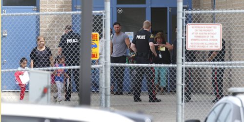 WAYNE GLOWACKI / WINNIPEG FREE PRESS     Winnipeg Police at the Prairie Rose School at 105 Lucas Ave. Wednesday morning.     May 25   2016