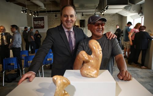 MIKE DEAL / WINNIPEG FREE PRESS  Originally from Whale Cove, Nunavut, artist Alex Alikashuak with Stephen Borys, WAG Director and CEO and some of his pieces that will be available at the new WAG shop that will be opening on June 25 at The Forks.   160525 Wednesday, May 25, 2016