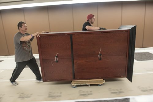 DAVID LIPNOWSKI / WINNIPEG FREE PRESS  (L-R) Rick Schwenzer and Eric Dienstbier of Winnipeg small moving specialists move office equipment from the Council building to the Administration building through the underground tunnel Wednesday May 25, 2016 while the Council building undergoes renovations .