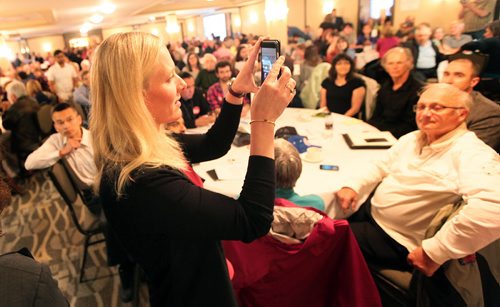 PHIL HOSSACK / WINNIPEG FREE PRESS -  (LOVE IN NO PROTESTORS)  Catherine McKenna Minister of the Environment and Climate Change takes a vidio at a packed Forum held in the Canad Inns Fort Garry Wednesday evening. A room packed to past occupancy limits delayed the forum. See story.  May 25, 2016