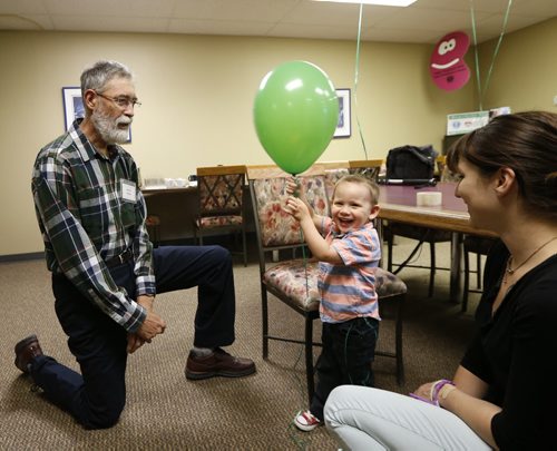 WAYNE GLOWACKI / WINNIPEG FREE PRESS   At left , Adrien Perras,a kidney transplant recipient celebrating his 40th anniversary of his transplant operation at the Kidney Foundation of Canada, Manitoba Branch Thursday visits with Amy Wasicuna and her 2-year-old son Wyatt living with kidney disease. Ashley Prest story  May 26   2016