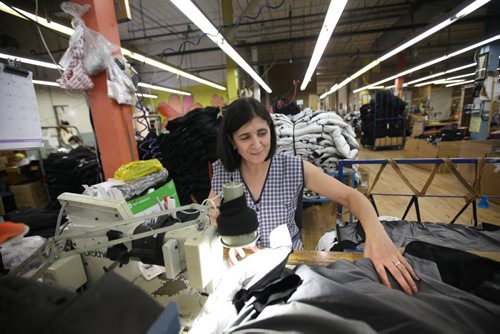 RUTH BONNEVILLE / WINNIPEG FREE PRESS  BIZ -  Sewing operator works on Moose Knuckles jacket at a manufacturing plant in Winnipeg.  For story on  outerwear manufacturer, Moose Knuckles,  facing sanctions from the Competition Bureau over alleged false "Made in Canada" claims.  Martin Cash story.    May 26,  2016