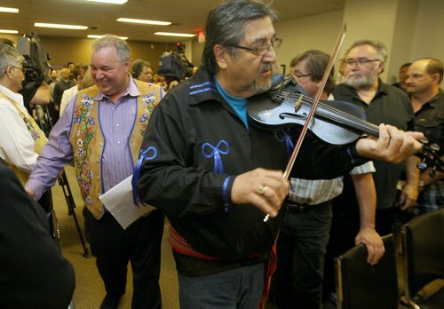 JOE BRYKSA / WINNIPEG FREE PRESS  A historic signing today between The Manitoba Metis Federation and the Federal government occurred in Winnipeg between Manitoba Metis Federation President David Chartrand and Federal Minister of Indigenous and Northern Affairs Carolyn Bennett- The signing of the Memorandum of Understanding will explore talks on reconciliation with the Manitoba Metis Community- David Chartrand and dignitaries enter room with a fiddler for historic signing- May 27 , 2016.(see Alex Paul  story)