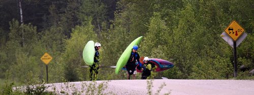 PHIL HOSSACK / WINNIPEG FREE PRESS -  PHOTOSTORY -  Left to right, Bradley Kulbaba, Steven Walker and Lori Neufeld shoulder their boats and walk towards a put in known as "The Culvert" on the Bird River north east of Lac Du Bonnet. May 26, 2016