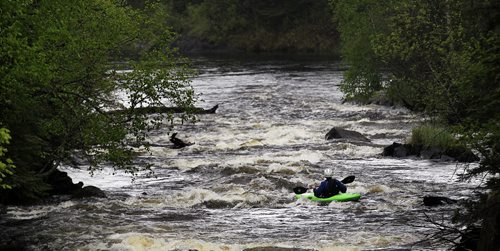 PHIL HOSSACK / WINNIPEG FREE PRESS -  PHOTOSTORY -  Bradley Kulbaba drifts down through small standing waves downstream of  "The Culvert" on the Bird River north east of Lac Du Bonnet. May 26, 2016