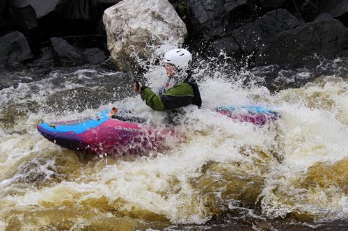 PHIL HOSSACK / WINNIPEG FREE PRESS -  PHOTOSTORY -  Lori Neufeld catches a faceful of spray exiting "The Culvert" on the Bird River north east of Lac Du Bonnet. May 26, 2016