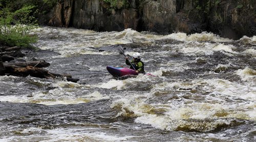 PHIL HOSSACK / WINNIPEG FREE PRESS -  PHOTOSTORY -  Lori Neufeld crosses to the far bank on the Bird River north east of Lac Du Bonnet to set up with rescue equipment before her paddling partner Steve Walker runs"The Canyon". May 26, 2016