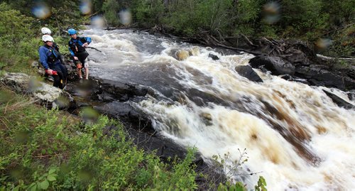 PHIL HOSSACK / WINNIPEG FREE PRESS -  PHOTOSTORY -  Left to right, Bradley Kulbaba, Lori Neufeld and Steven Walker survey "The Wall" before deciding to avoid it on this trip in favor of better levels, the went on to  run other sections of "The Bird. May 26, 2016