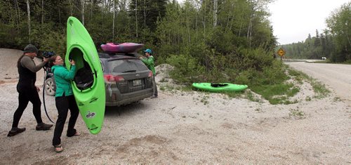 PHIL HOSSACK / WINNIPEG FREE PRESS -  PHOTOSTORY -  Left to right, Bradley Kulbaba, Lori Neufeld and Steven Walker unload their boats near their "put in" to run "The Bird" as paddlers call the Bird River whitewater sections east of Lac Du Bonnet. May 26, 2016
