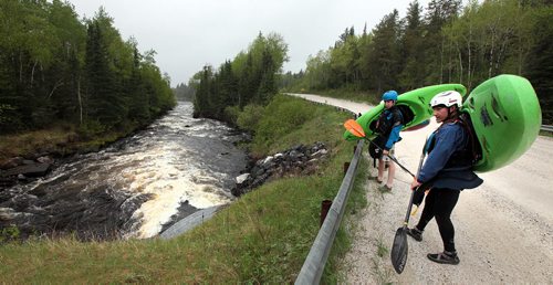 PHIL HOSSACK / WINNIPEG FREE PRESS -  PHOTOSTORY -  Left to right, Bradley Kulbaba (right) and Steven Walker survey their "put in" at a feature called "The Culvert" as they prep to to run "The Bird. May 26, 2016