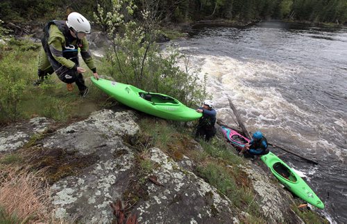 PHIL HOSSACK / WINNIPEG FREE PRESS -  PHOTOSTORY -  Left to right, Lori Neufeld radley Kulbaba and Steven Walker move their boats to a put in below "The Wall" , deciding to avoid it on this trip in favor of better levels, they went on to  run other sections of "The Bird. May 26, 2016